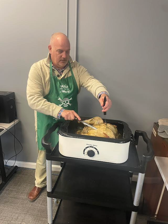 Mr. O'Leary carving the turkey.