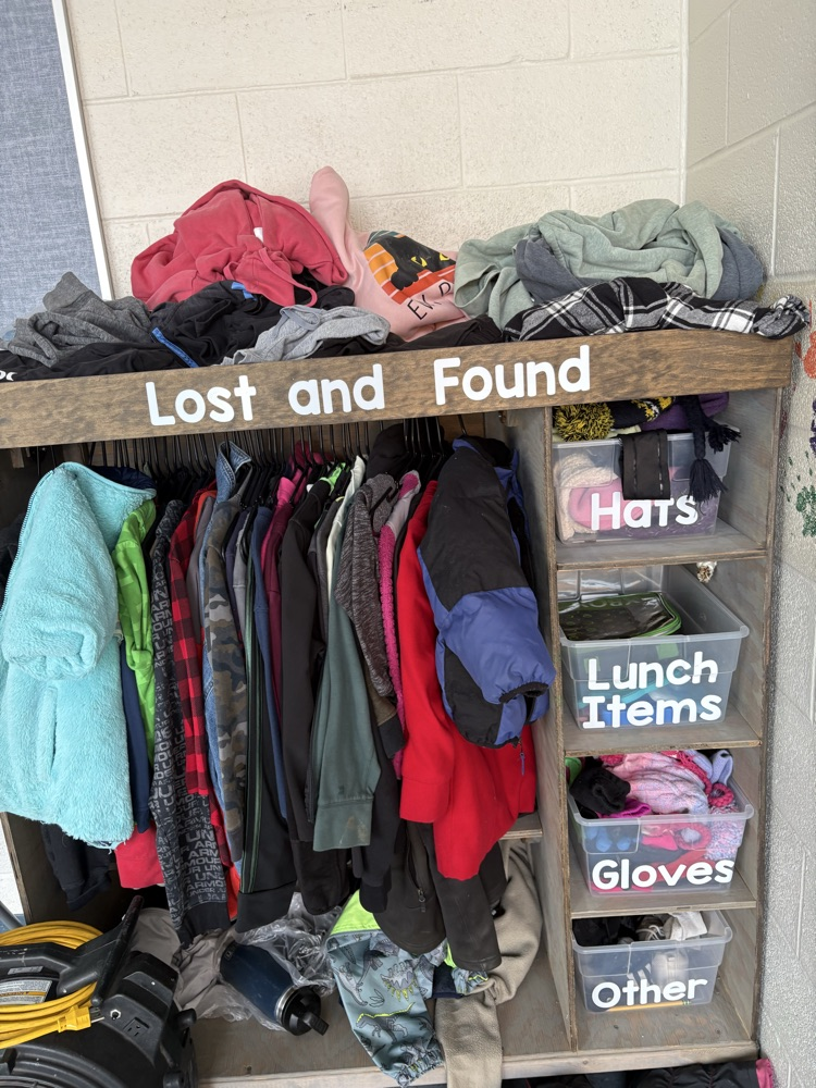 clothes in a Lost and Found wooden structure 