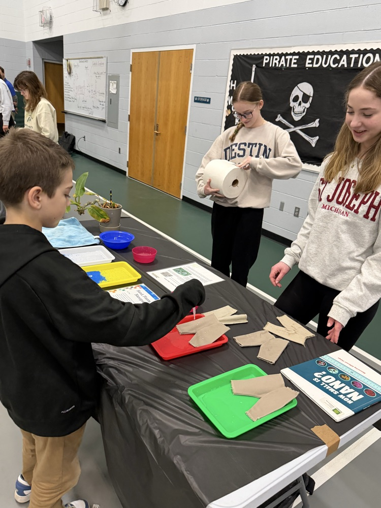 students standing at a table with activities 
