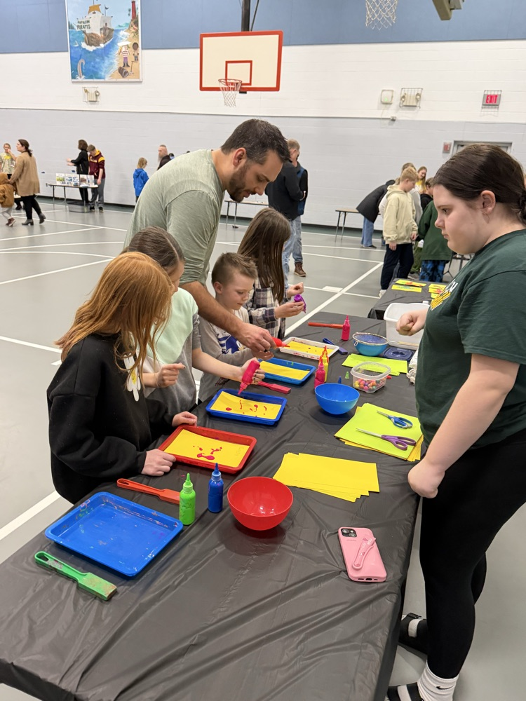 students doing activities at a table