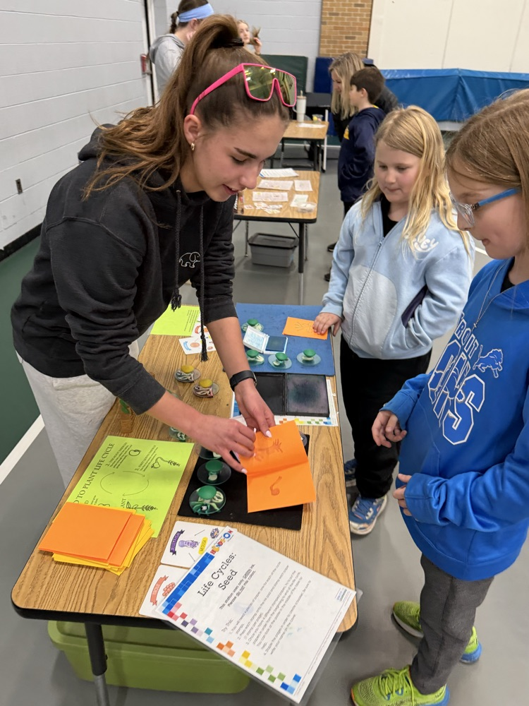 students doing activities at a table