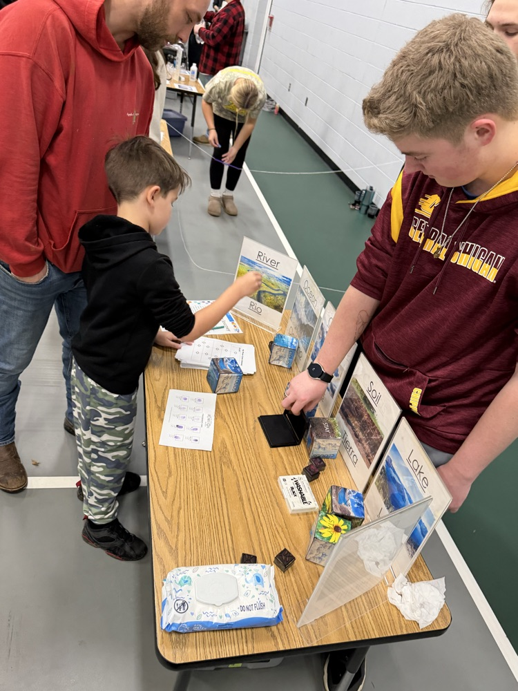 students doing activities at a table