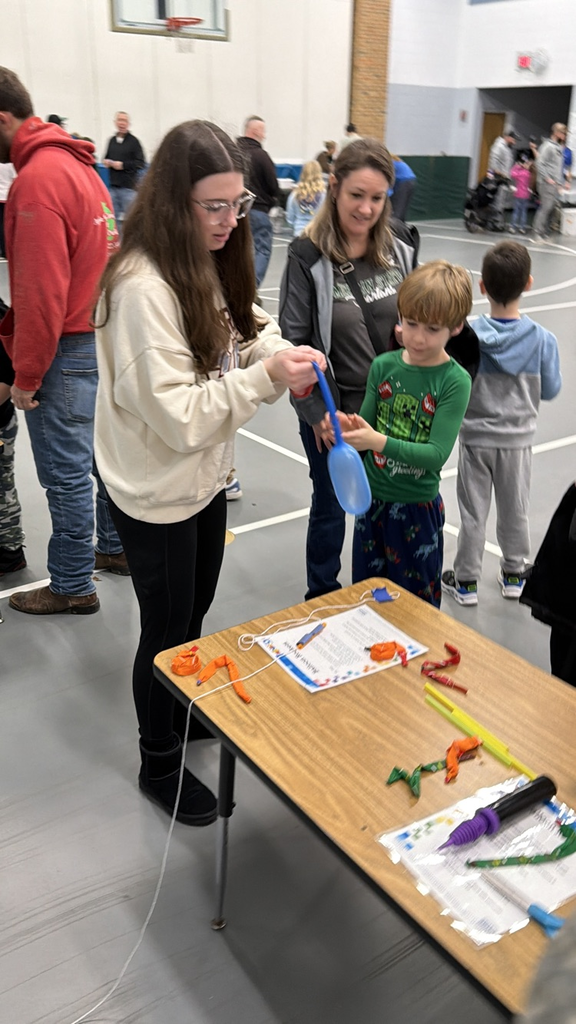 students doing activities at a table