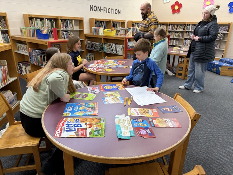 students in library working on activities 