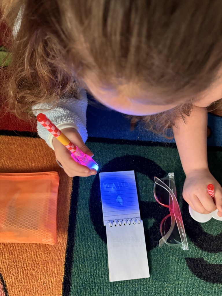 student using a secret pen to read a message