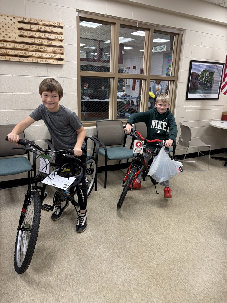 boys on bikes in school office