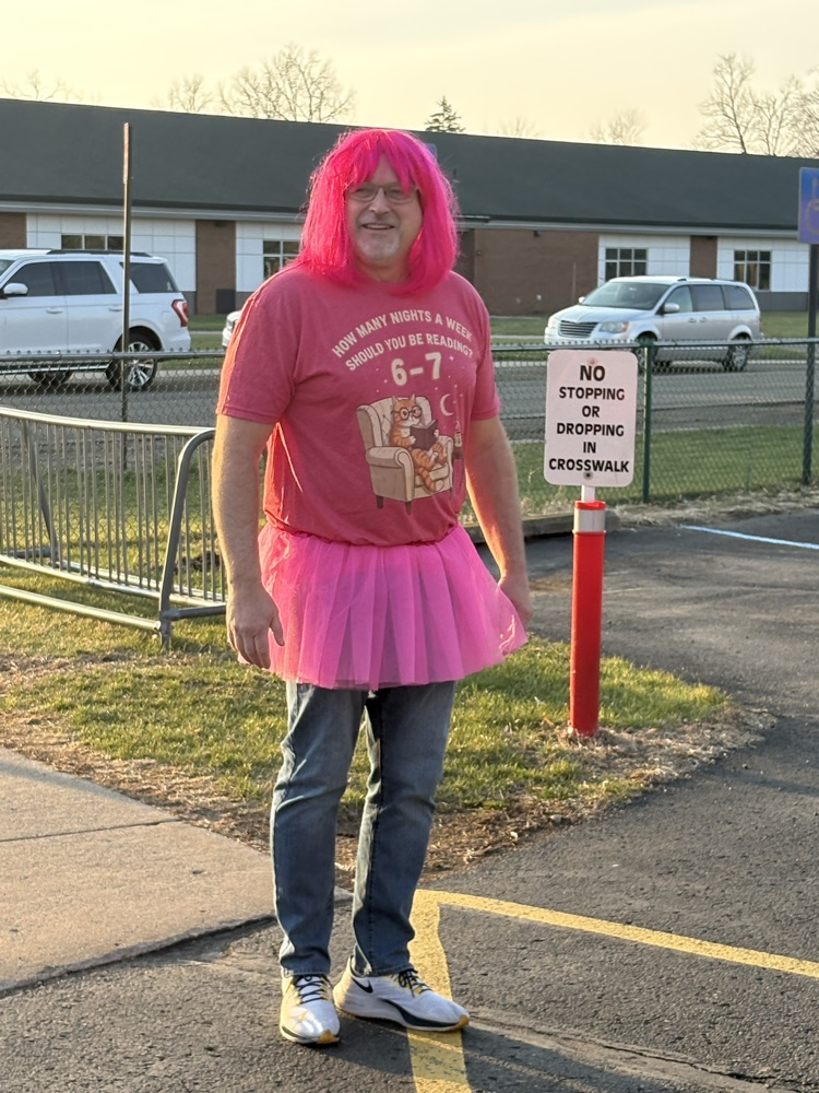 man dressed in pink tutu and pink wig