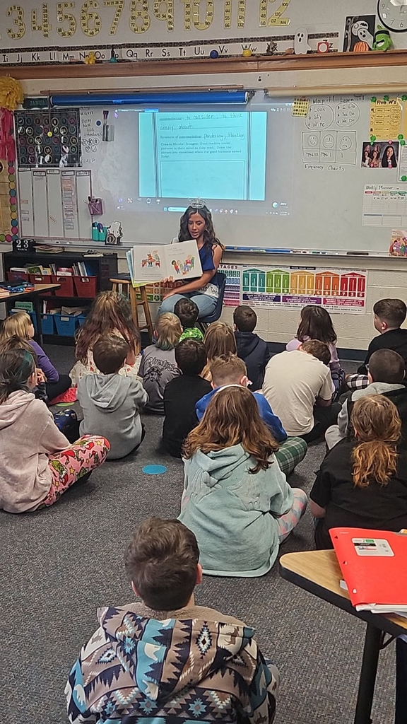 Miss Teen Crossroads reading to third grade students