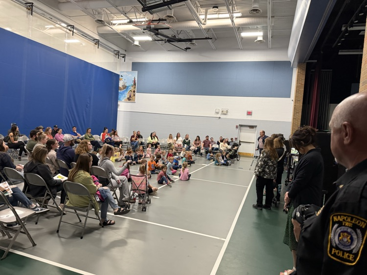 a large crowd in a gym