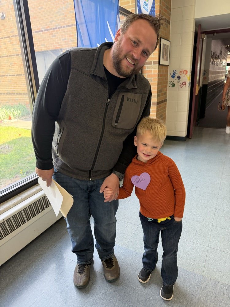 father and son in hallway at school 