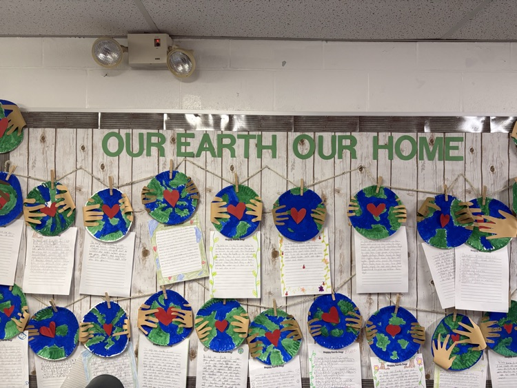 earth day artwork on bulletin board