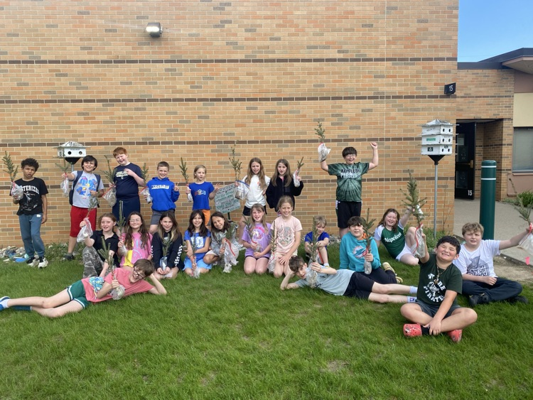 students holding trees