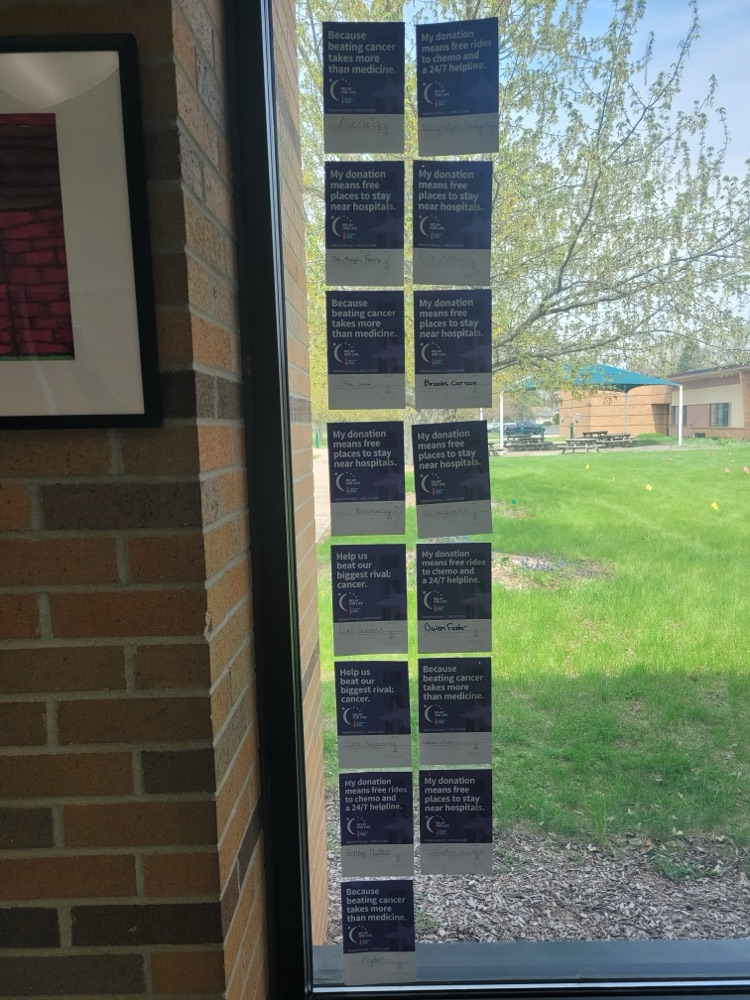 relay for life donation cards on window 