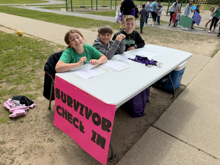 table with kids sitting at it for relay for life