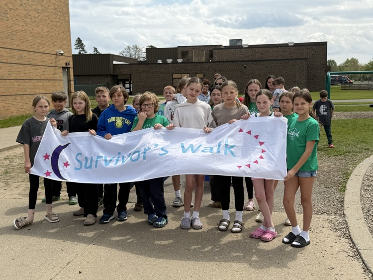 students holding a banner