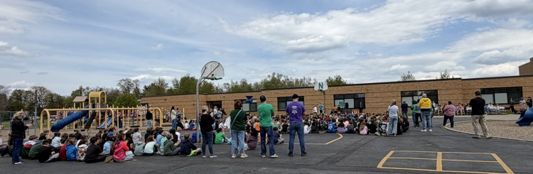 people standing on blacktop