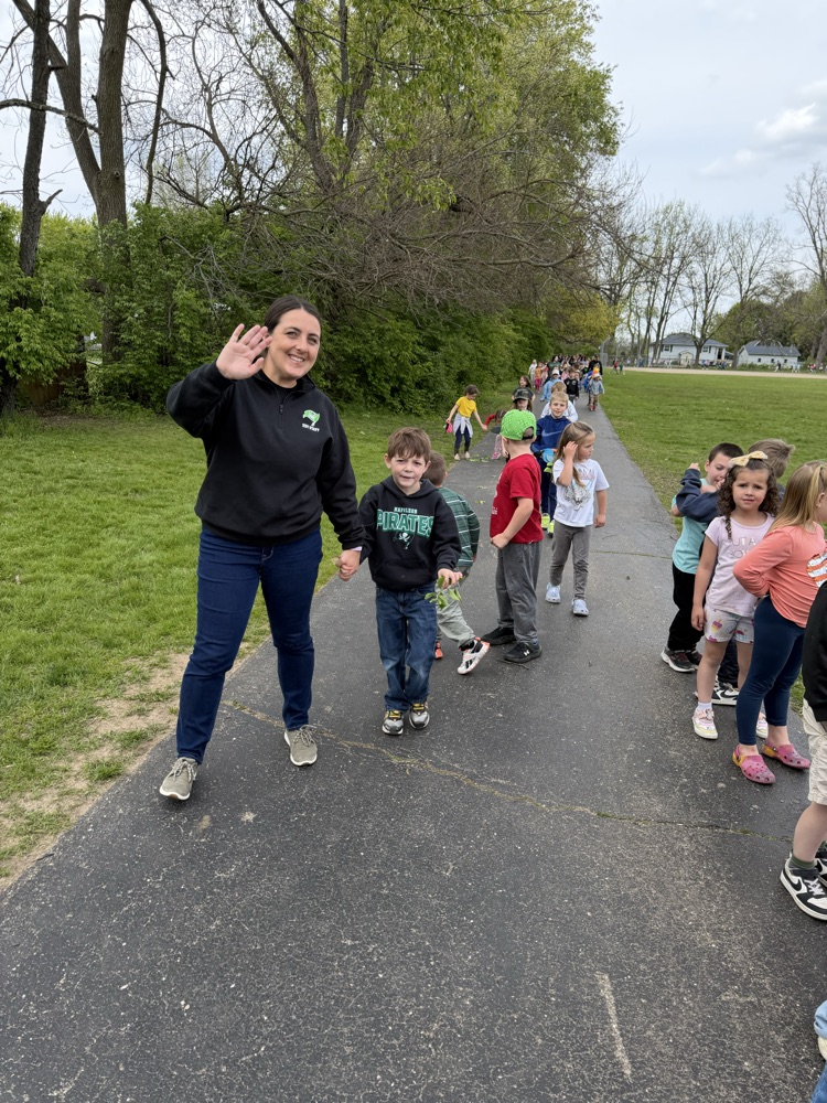 teacher with her students on track