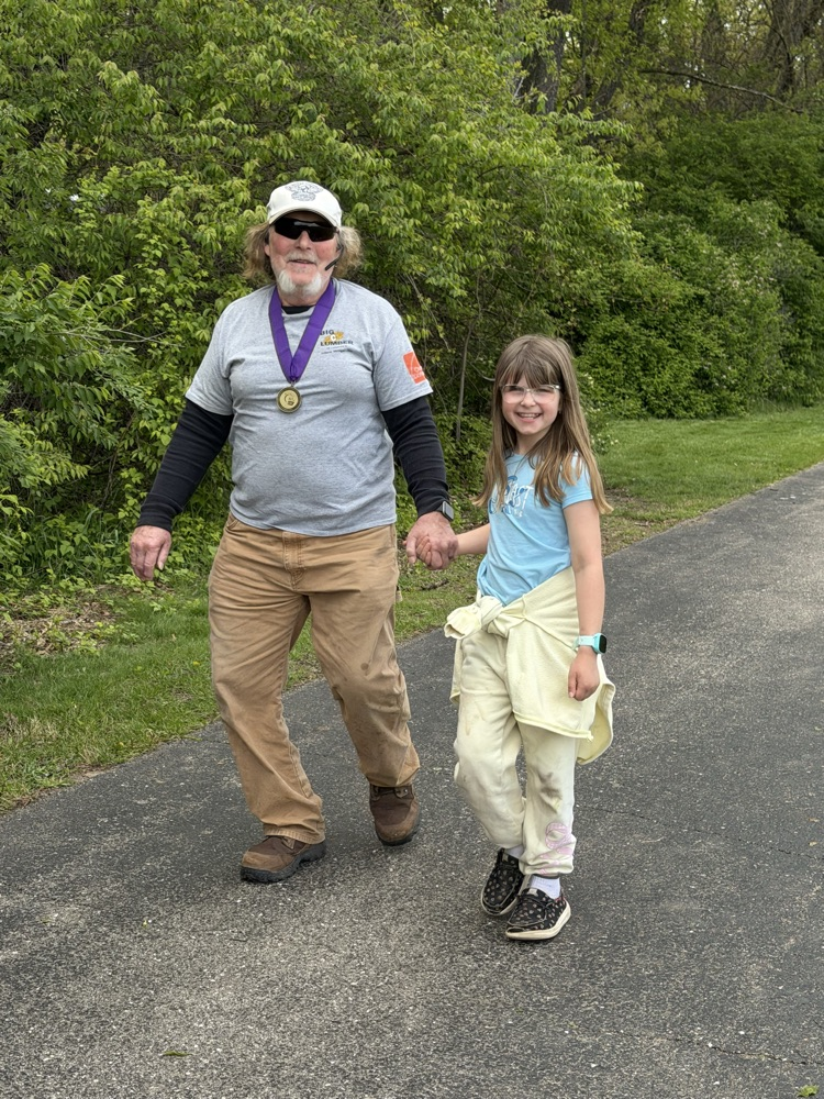 man and girl on track