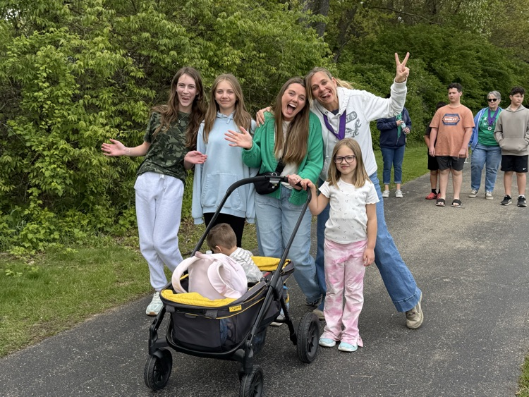group of people with stroller on track