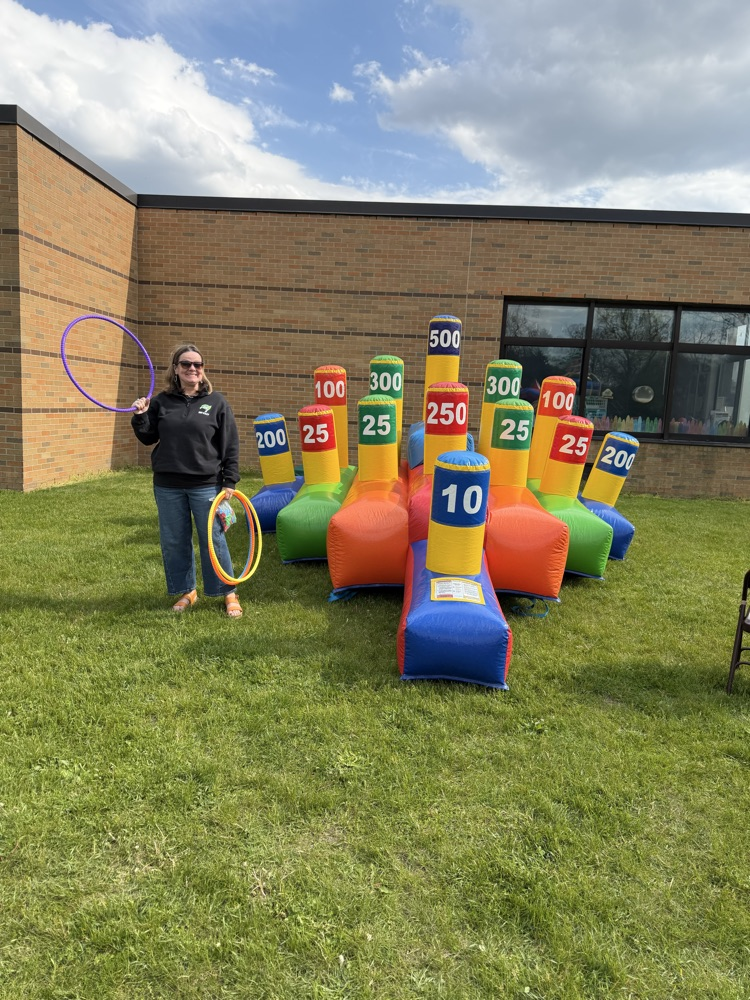 woman standing by inflatable game
