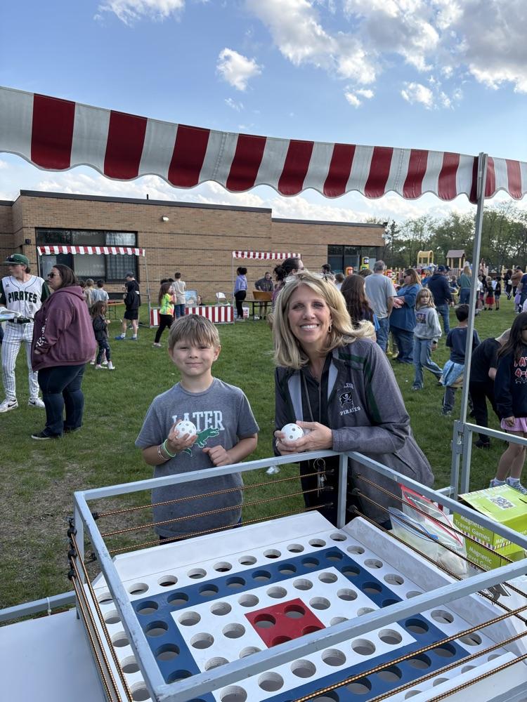 woman and child at a carnival game