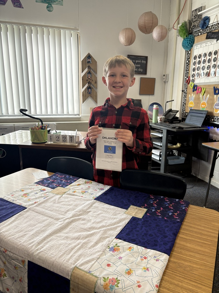 student with quilt project