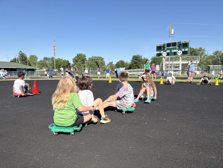 students on scooters at field day