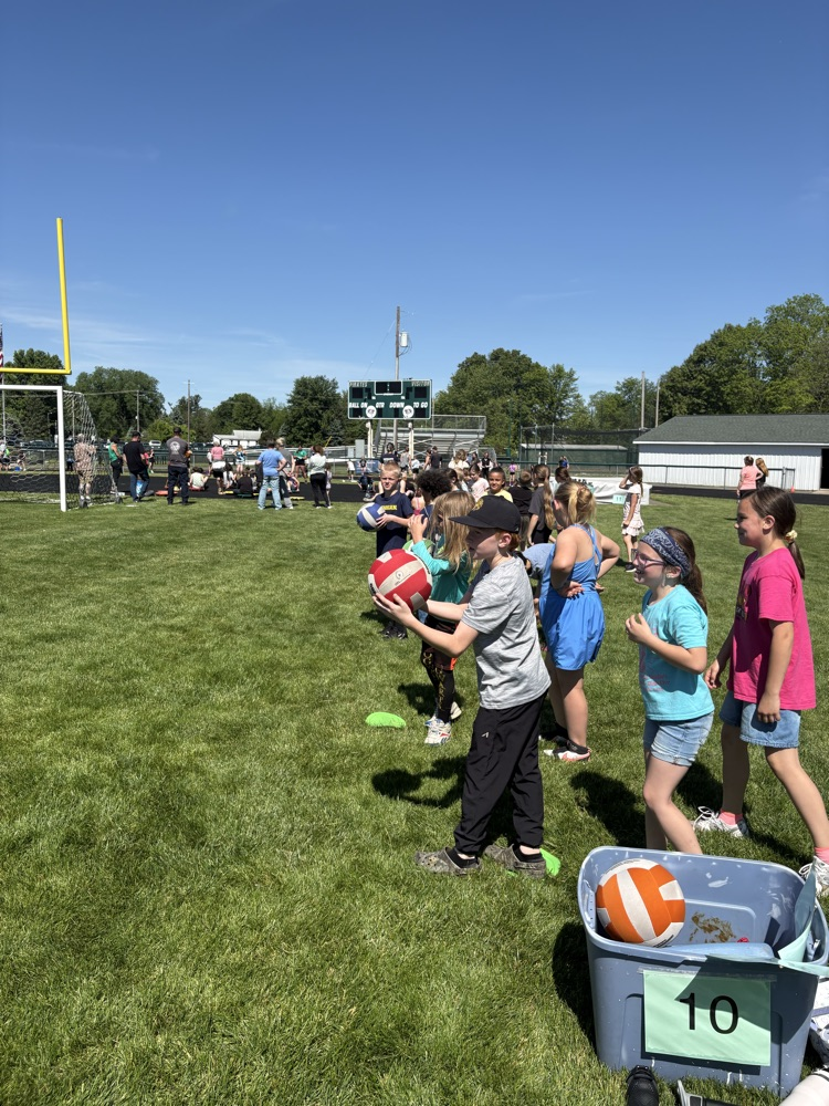 kids playing ball on football field