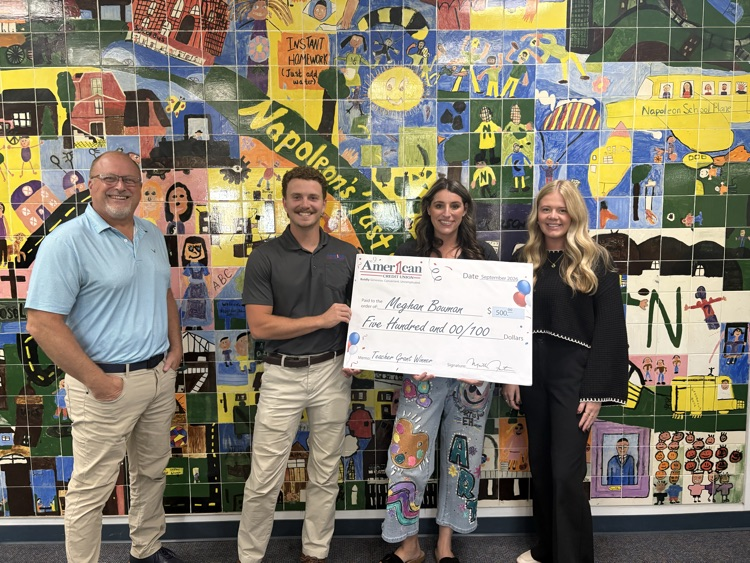 two men and two women holding a cardboard American One check for $500 at school