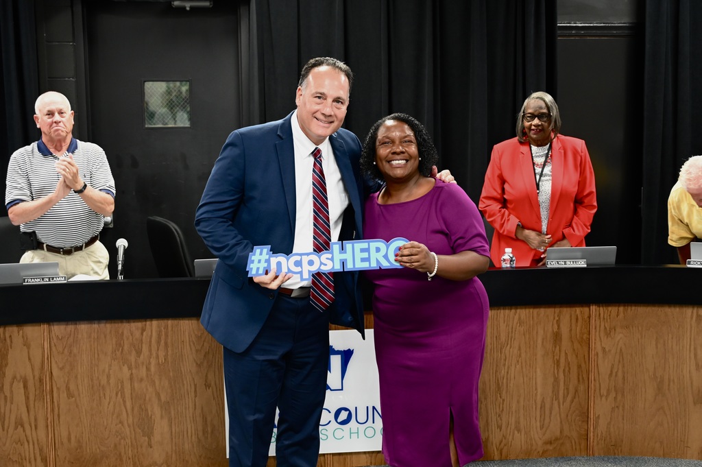 Photo of Dr. Ellis holding award