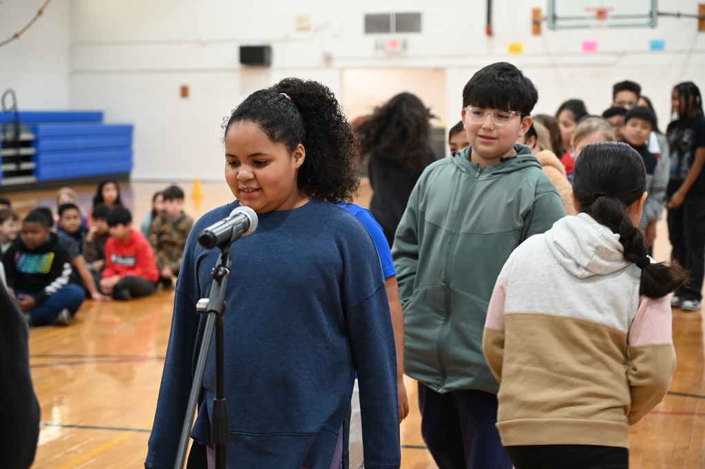 student at microphone