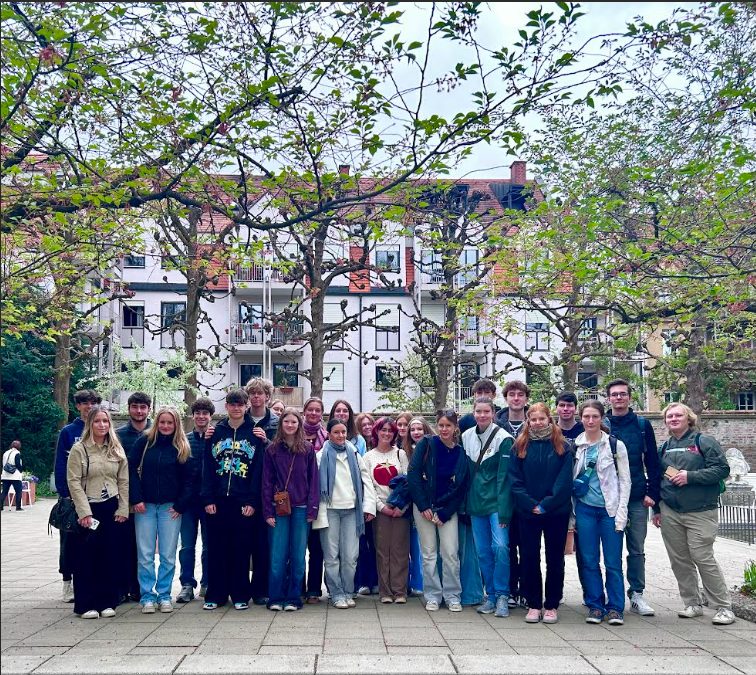 NRHS students post together in a courtyard.