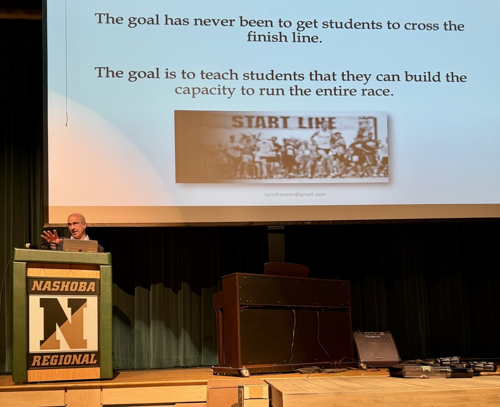 Author and keynote Tony Frontier stands on the NRHS stage.