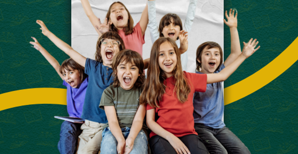 students sitting in a group smiling.