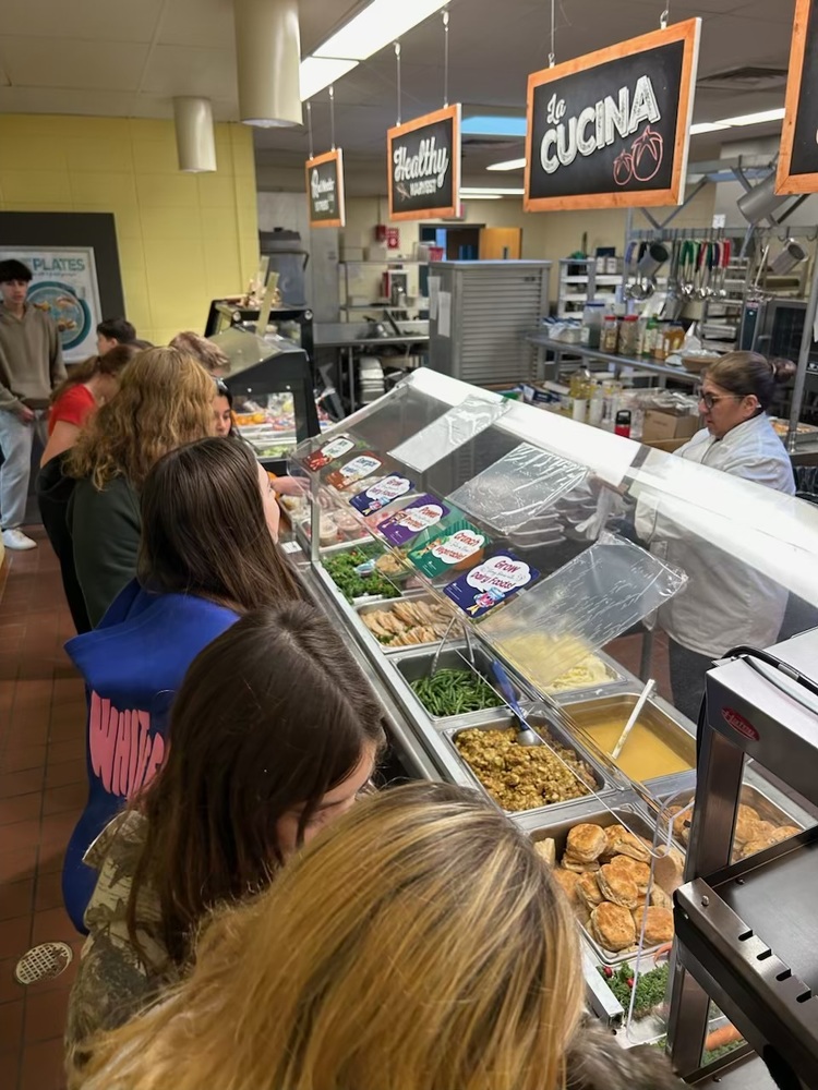 Students waiting in cafeteria serving line