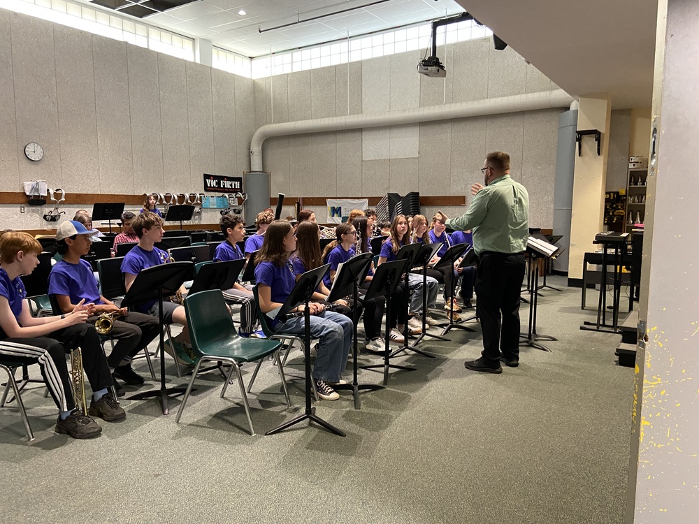 Hale band students sit in the NRHS band room