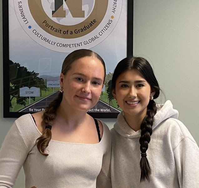 The valedictorian and salutatorian at NRHS post together.