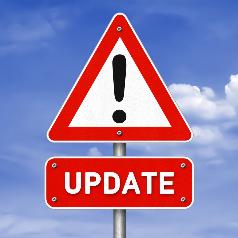 A road sign with an exclamation mark and the word update