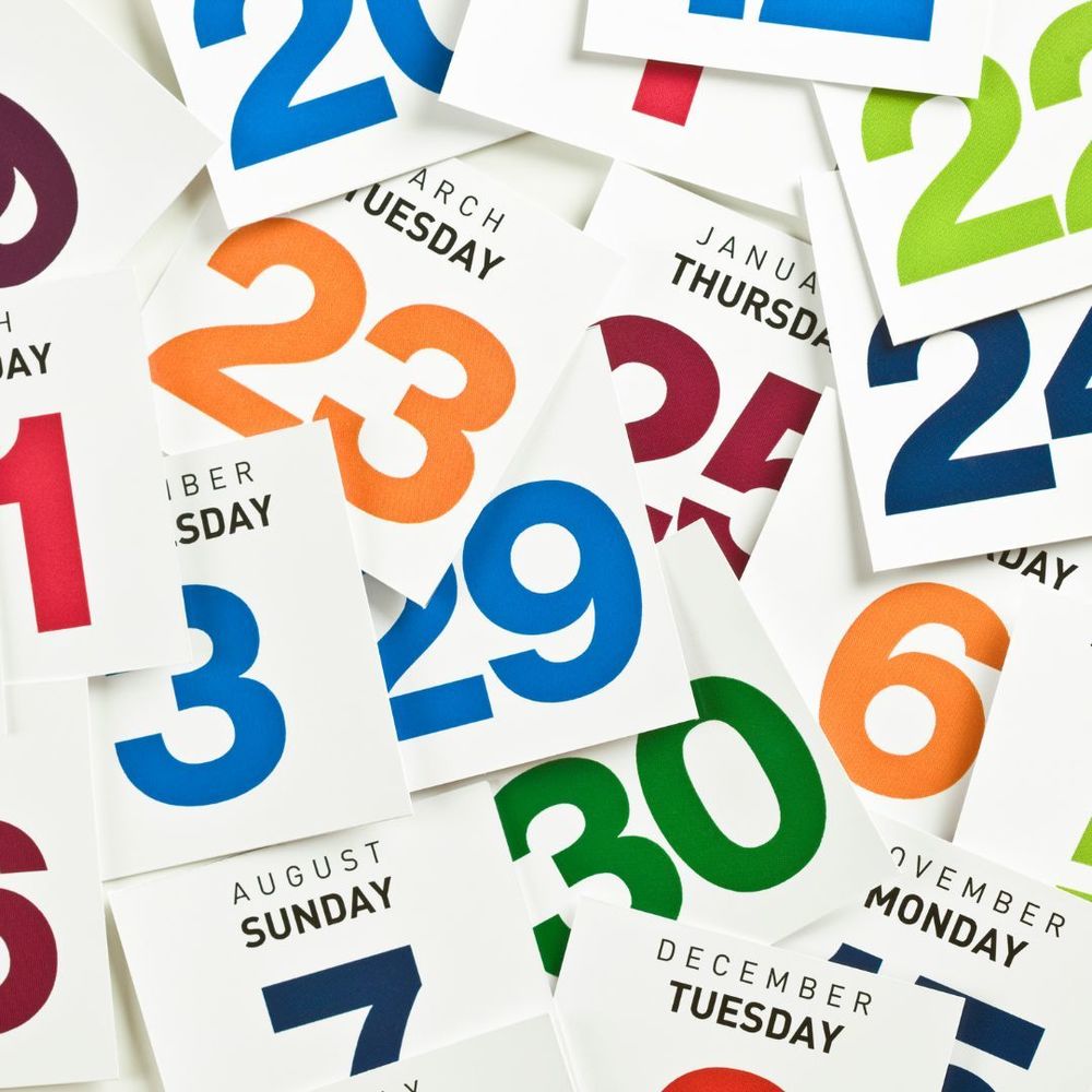 Calendar days and number cards piled on top of each other.