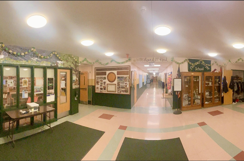 Florence sawyer lobby with green and yellow gratitude chains hanging.