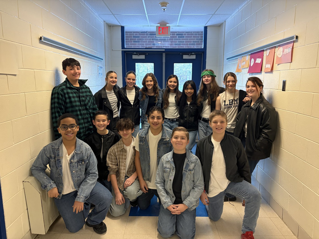 LBMS students pose together in outfits inspired by The Outsiders.