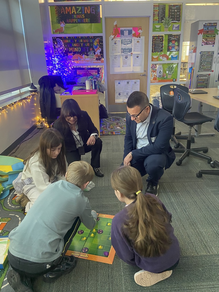 Students play a coding board game.