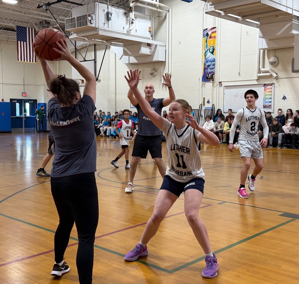 Staff and LBMS students participate in a staff versus student basketball game.
