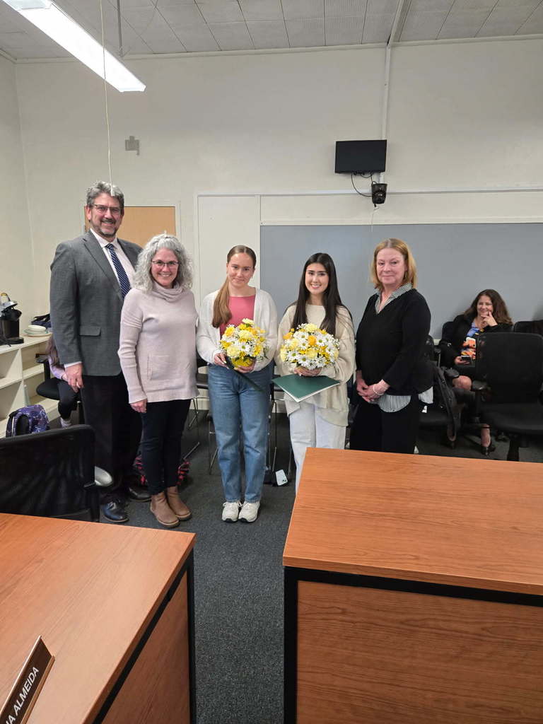 Superintendent Downing, School Committee Chair Vivirito, NRHS Principal Boynton, pose with the valedictorian and salutatorian.