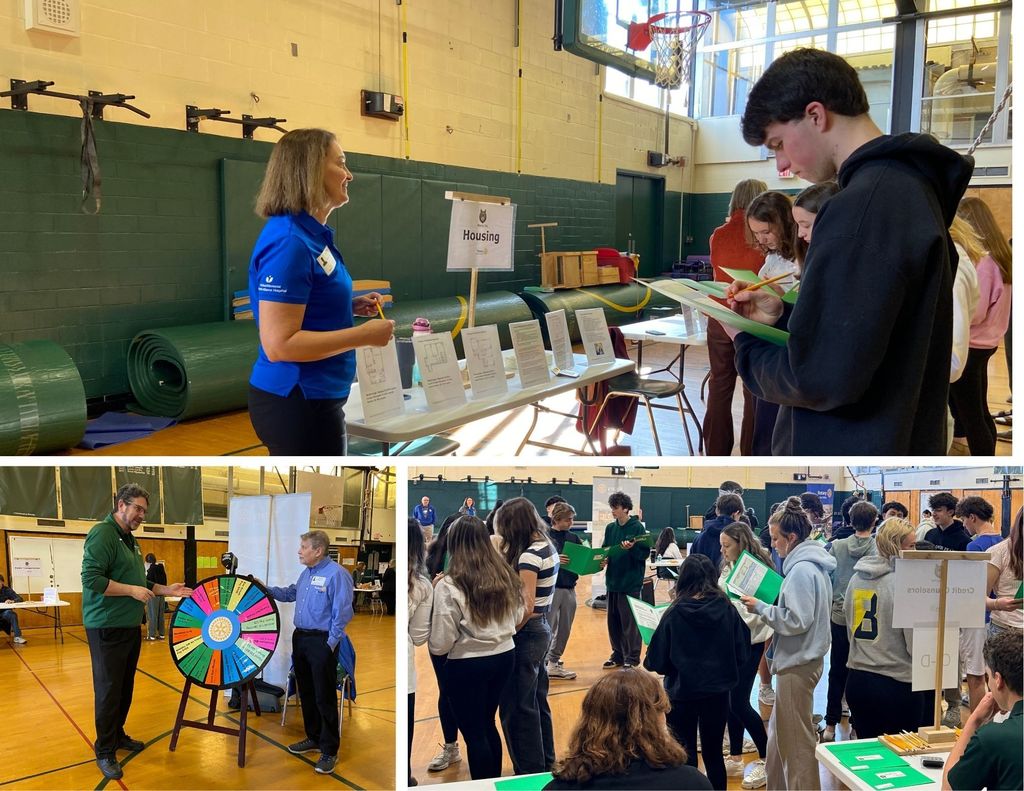 Sophomore students and district staff walk around the lower gym for the reality fair.