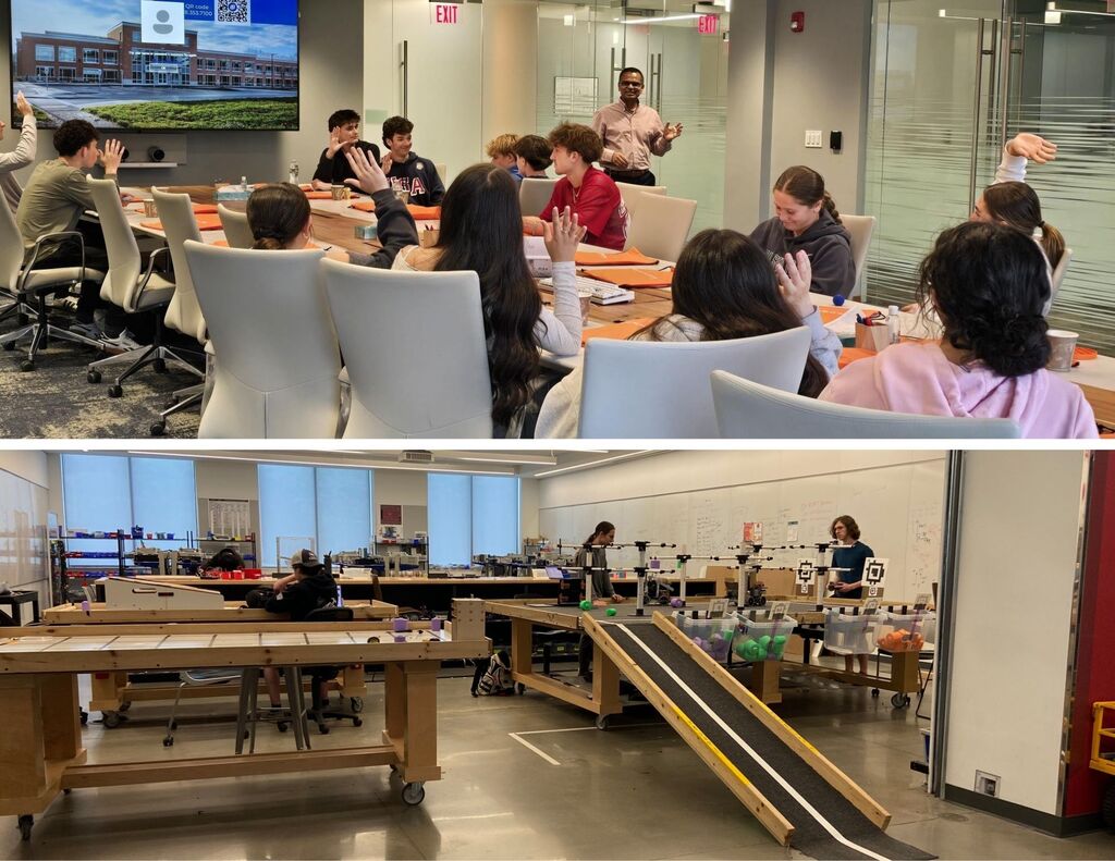 Students sit around a table raising their hands. Students also work in a makers space with robotics arenas.