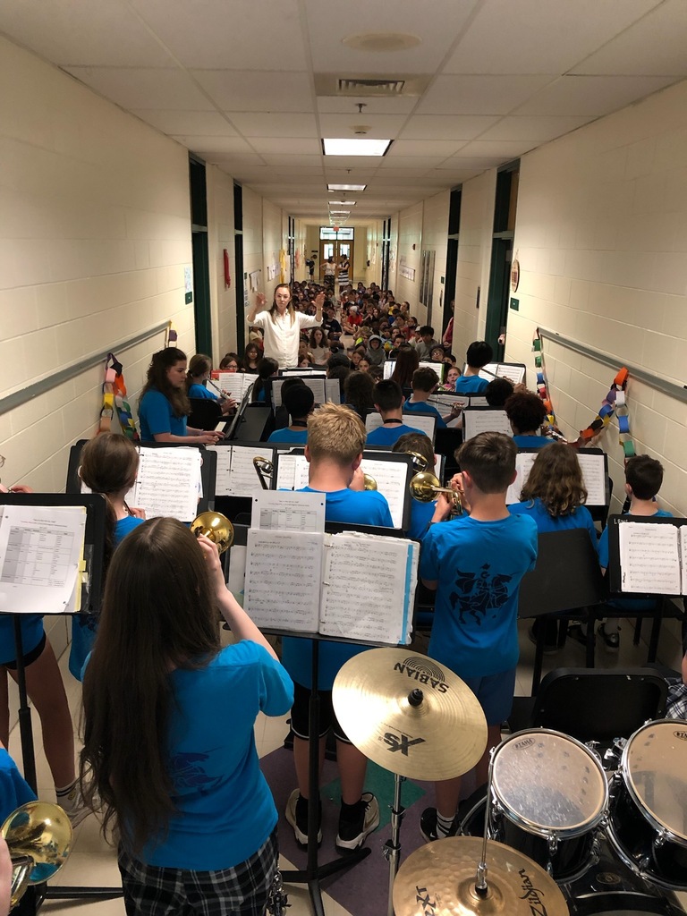 LBMS band students play for MRE students in the hallway.