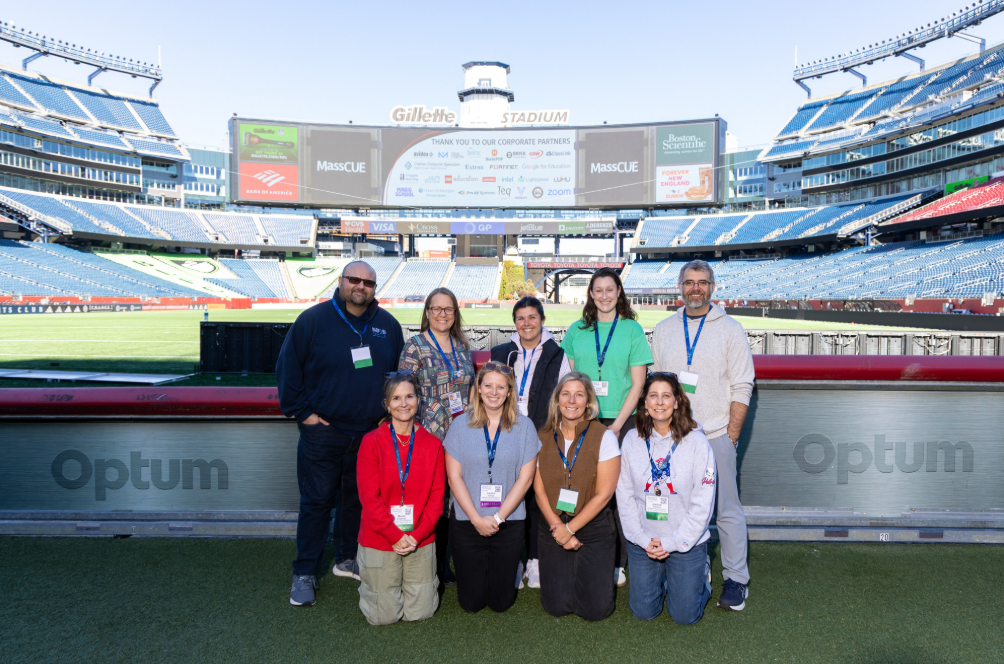 NRSD educators pose in front of the Gillette Stadium field while visiting MassCUE.