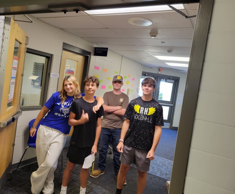Ciara Carney, a Viking Mentor from Chelmsford, leads a group of ninth-graders – from left, her brother, Andrew Carney, Caleb Crowley of Chelmsford and Nicholas Deschenes of Townsend – on a tour of Nashoba Tech during Freshman Orientation. (COURTESY NASHOBA TECH)