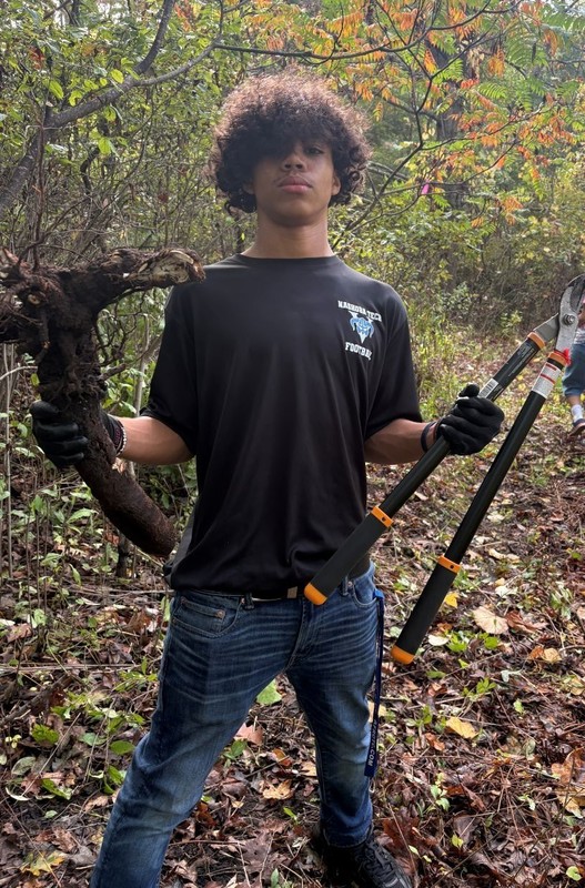 Freshman Braylon Freeman (Chelmsford) is ready for action during Nashoba Tech’s Day of Service.